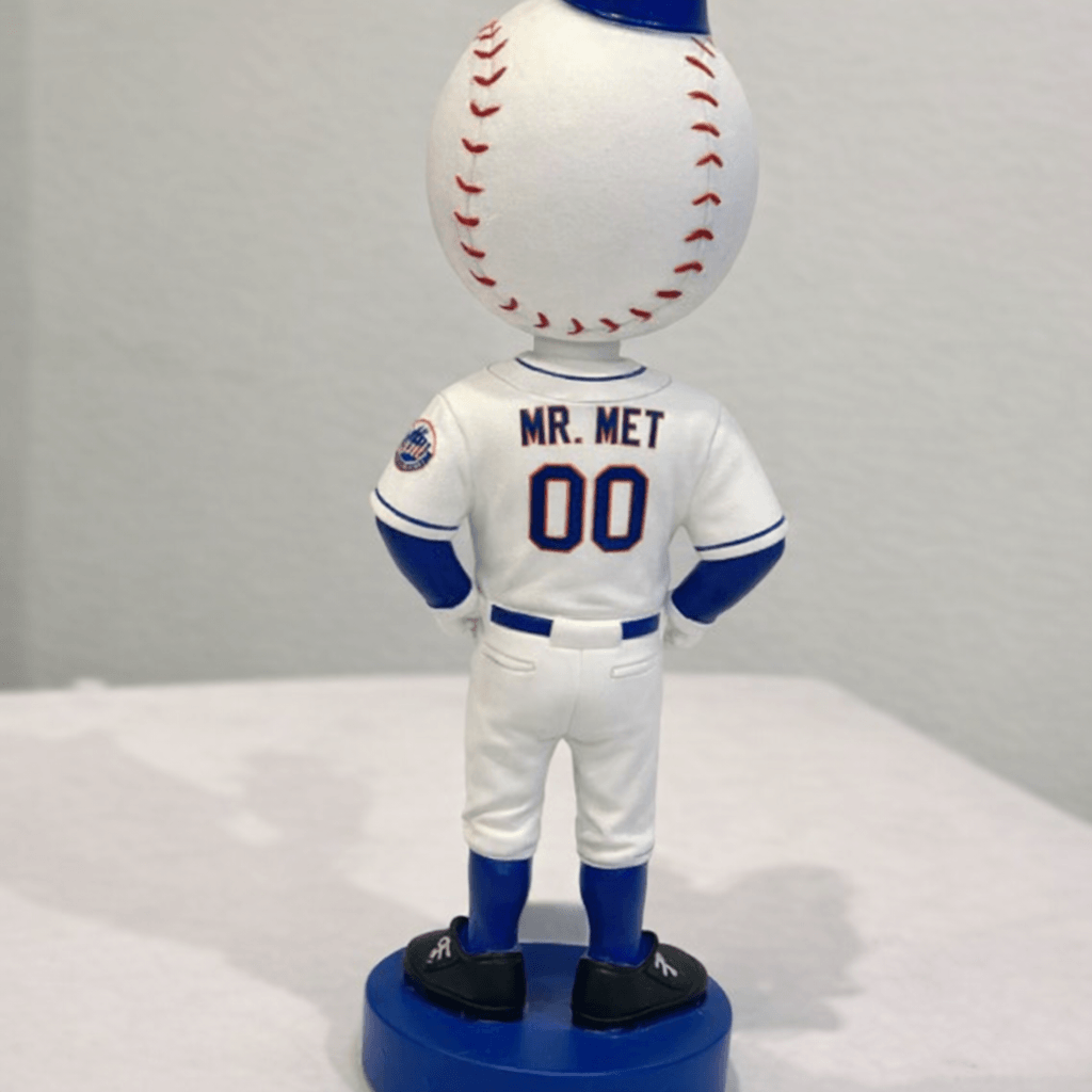 Back view of Mr. Met bobblehead showing jersey number 00 and blue Citi Field base.