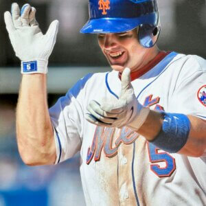 David Wright on‑field action photo chasing a ball past third base. $15 Mets collectible