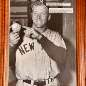 Mickey Mantle pointing to damaged baseball from his 565‑foot home run