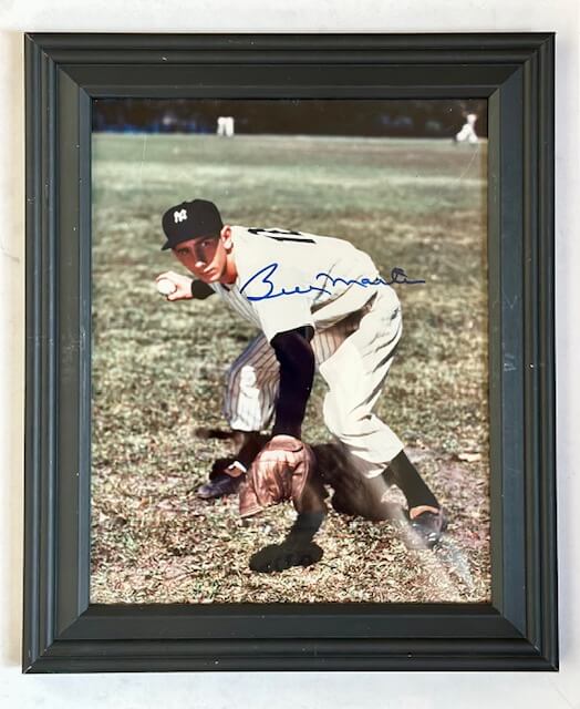 Autographed Billy Martin Yankees photo showing him fielding a ground ball and throwing to first in a color action shot